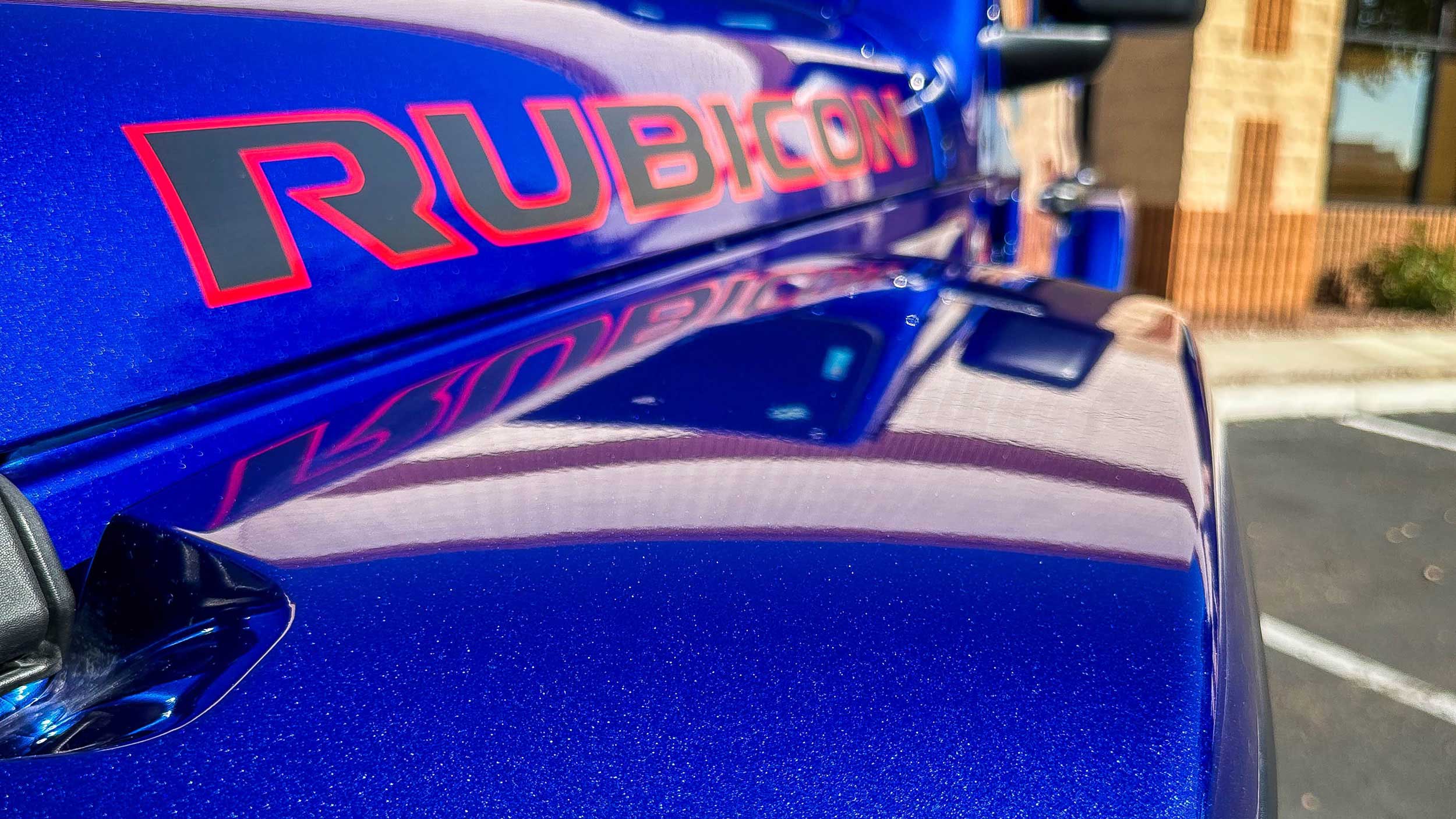 Close up of the word Rubicon on the hood of a jeep