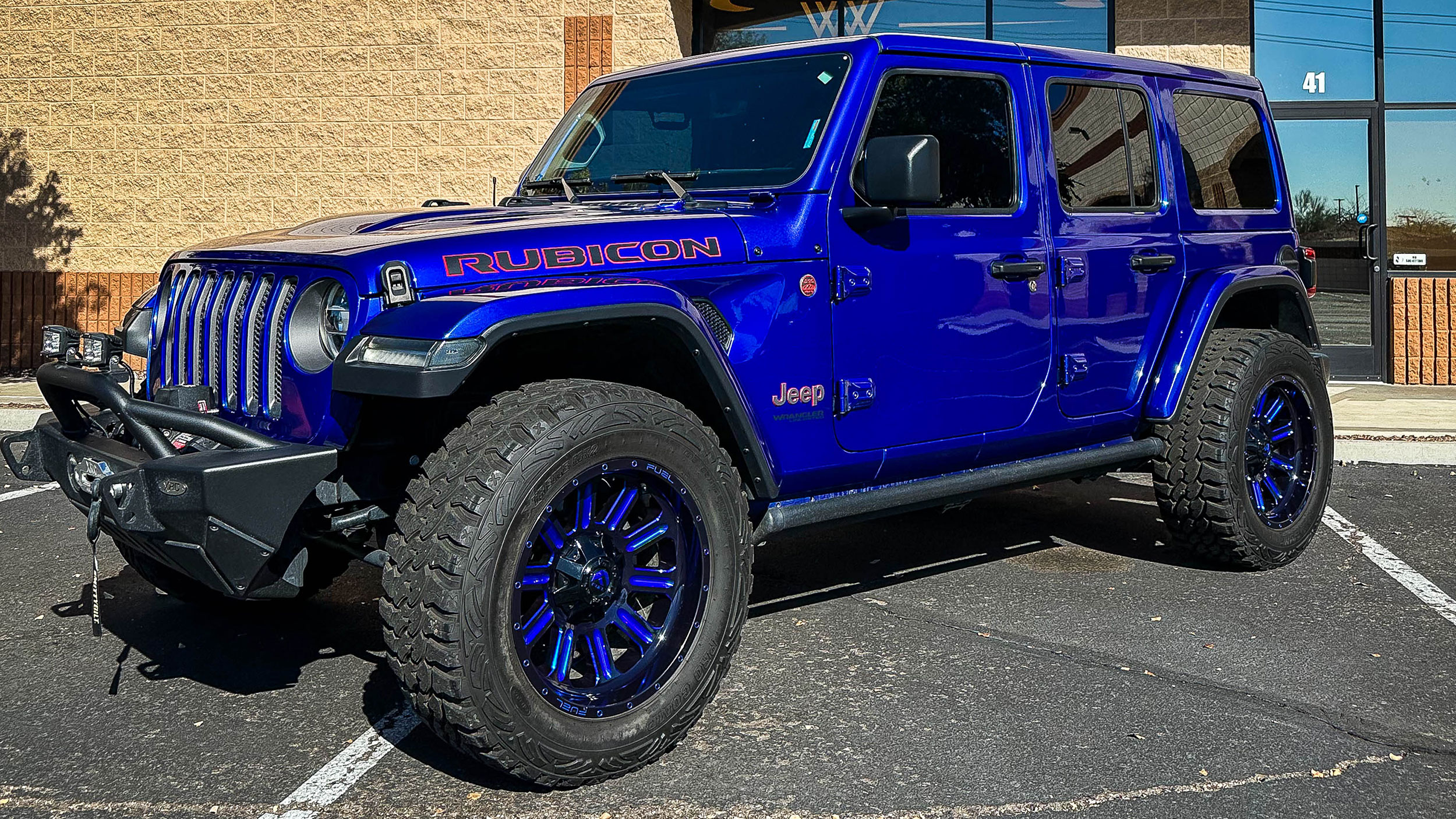 Jeep outside shop curring in the sun