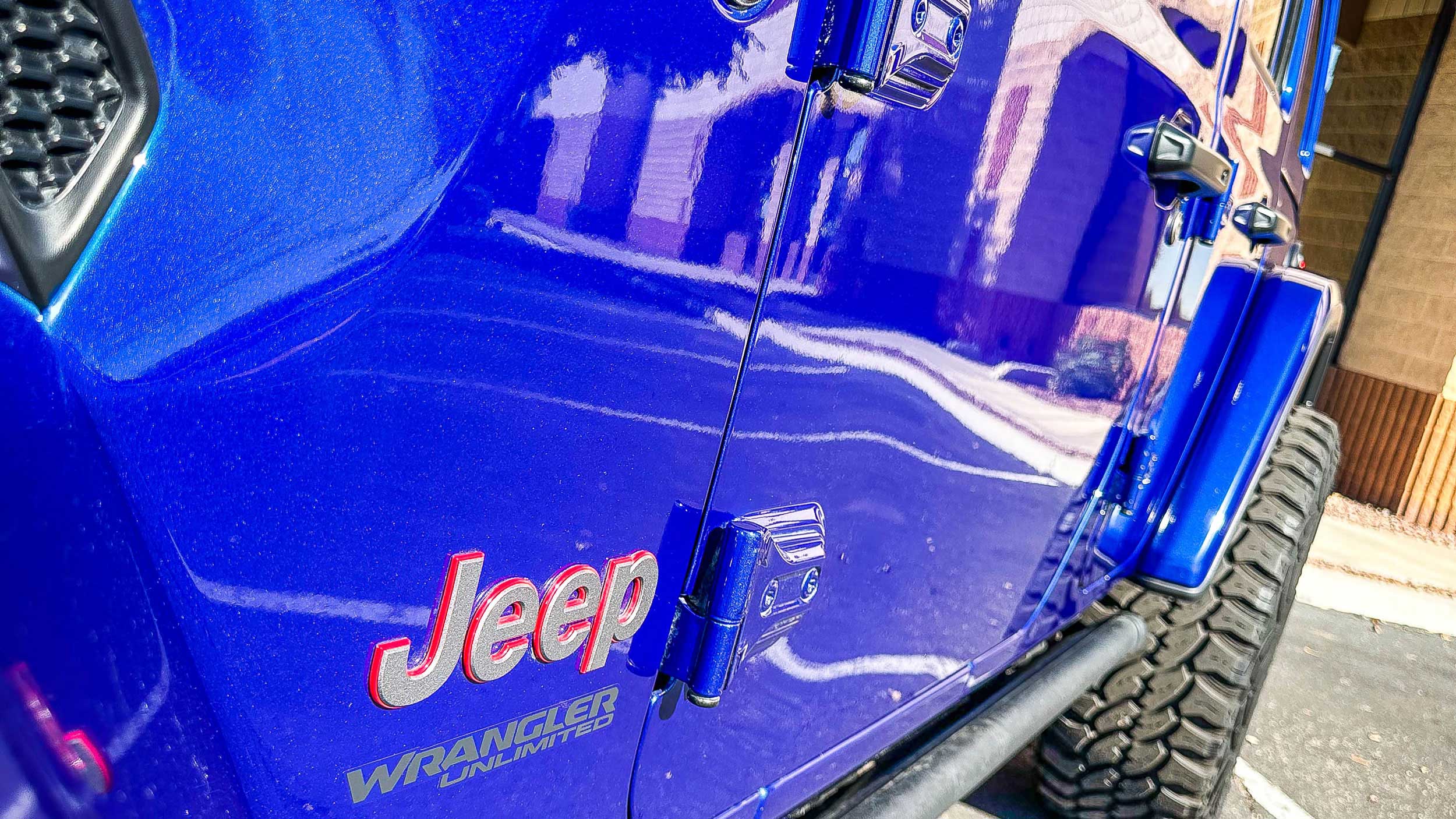 Drivers side of blue jeep with ceramic coating